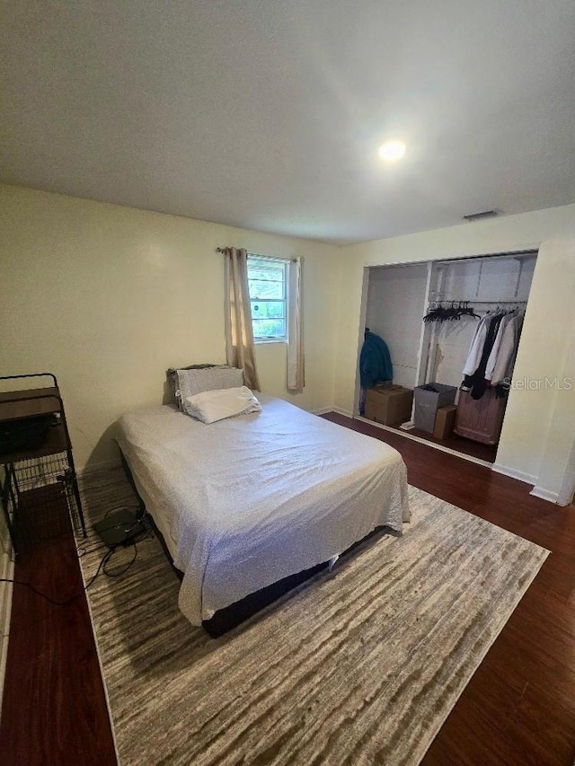 bedroom featuring dark hardwood / wood-style flooring