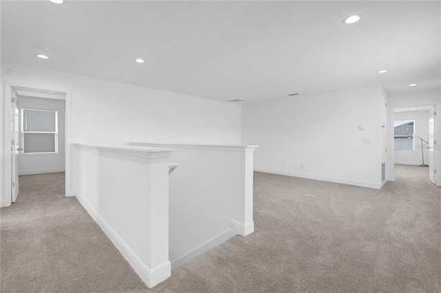 14442 Noto Ave, Clermont, FL 34714 - hallway with an upstairs landing, carpet floors, and recessed lighting
