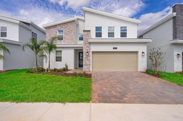 view of front facade with a front lawn and a garage