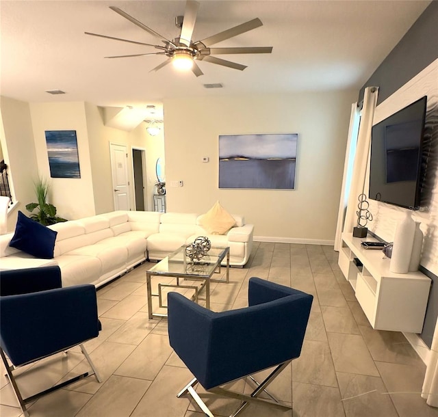 living room with ceiling fan and light tile patterned floors