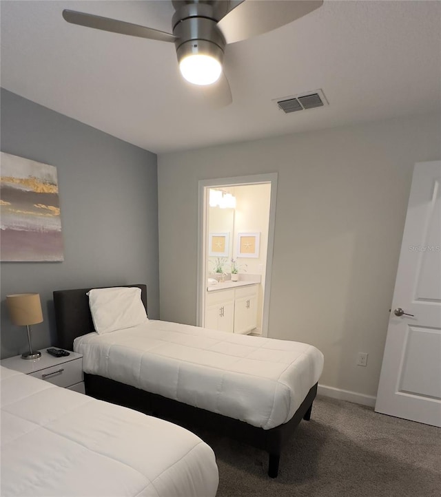 bedroom featuring ceiling fan, carpet, and ensuite bathroom