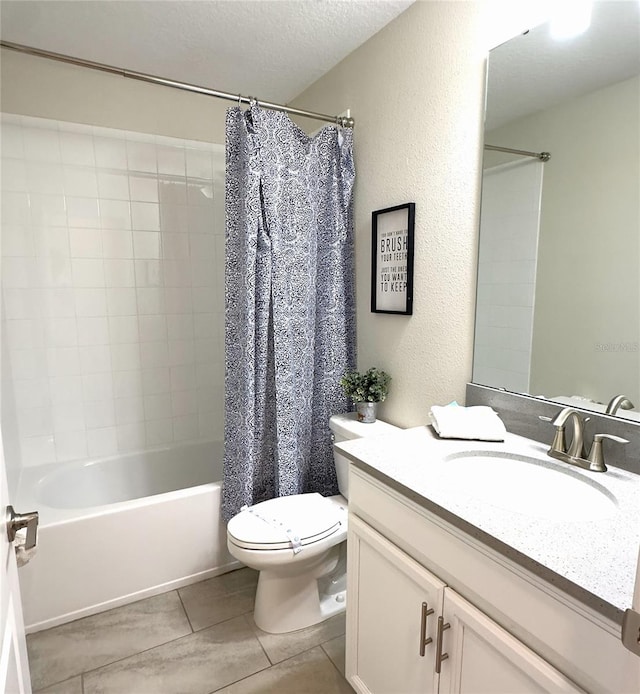 full bathroom featuring tile patterned floors, a textured ceiling, toilet, vanity, and shower / tub combo