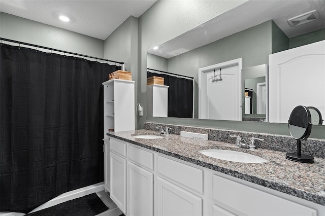 bathroom featuring vanity and tile patterned floors