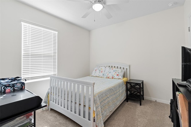 carpeted bedroom featuring ceiling fan