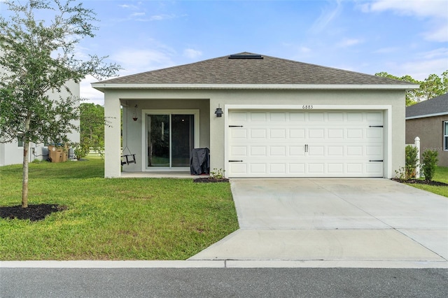 ranch-style home with a garage and a front yard