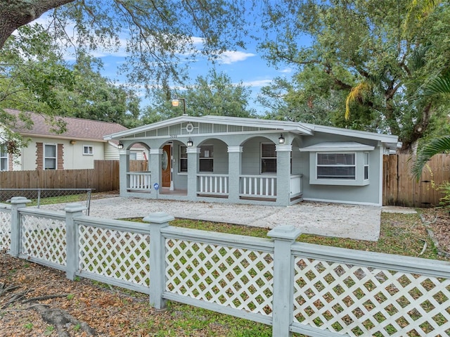 ranch-style home with covered porch