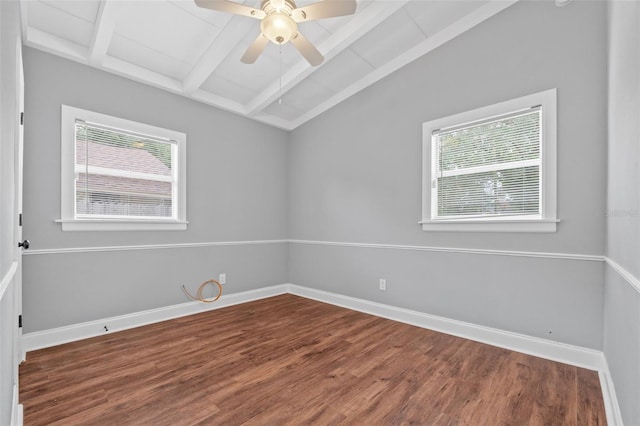 empty room featuring hardwood / wood-style flooring, ceiling fan, and vaulted ceiling with beams