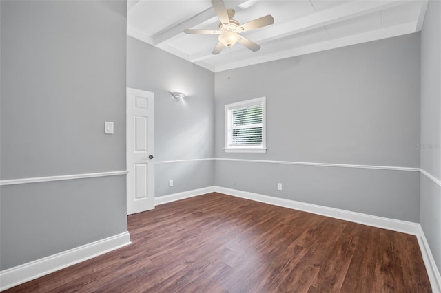 spare room with dark wood-type flooring, ceiling fan, and beam ceiling