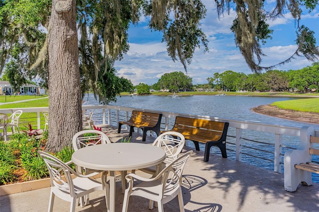 view of patio with a water view