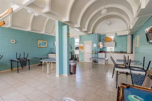 kitchen featuring light tile patterned floors and sink