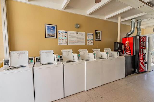 clothes washing area with washing machine and clothes dryer