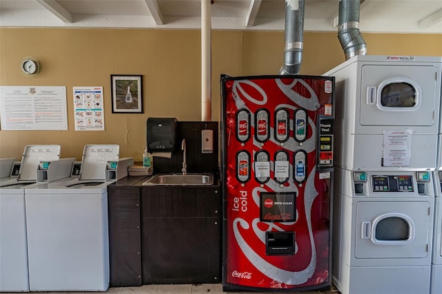 laundry room featuring stacked washing maching and dryer and sink