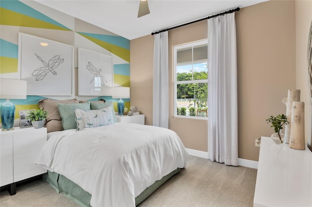 bedroom with ceiling fan and light colored carpet