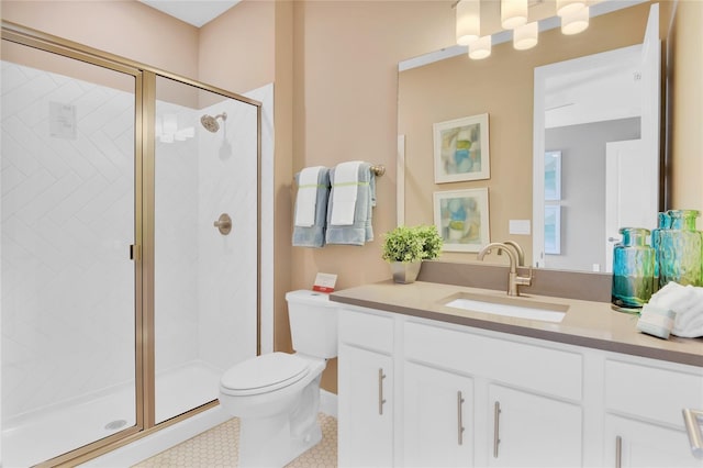 bathroom featuring toilet, vanity, tile patterned flooring, and a shower with door