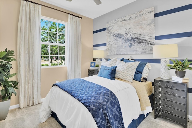 bedroom with light carpet and ceiling fan