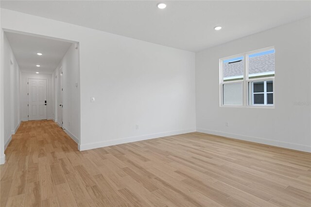 4060 Bannock Ave, Tavares, FL 32778 - empty room with light wood-style flooring, baseboards, and recessed lighting