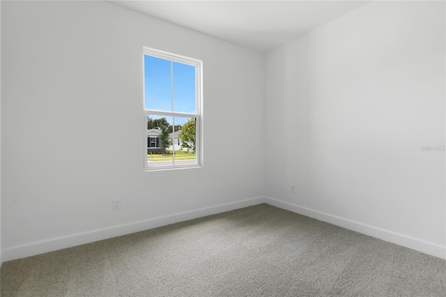 4060 Bannock Ave, Tavares, FL 32778 - spare room featuring carpet floors and baseboards