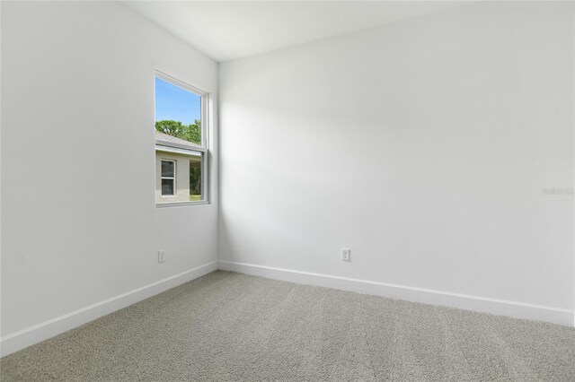 4060 Bannock Ave, Tavares, FL 32778 - carpeted empty room with baseboards