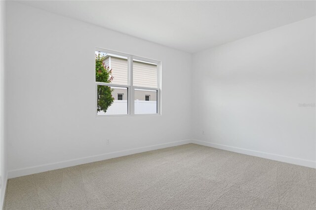 4060 Bannock Ave, Tavares, FL 32778 - empty room with carpet and baseboards