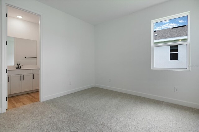 4060 Bannock Ave, Tavares, FL 32778 - unfurnished room with light carpet and baseboards