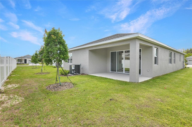 4060 Bannock Ave, Tavares, FL 32778 - back of property featuring stucco siding, a patio, and central AC unit