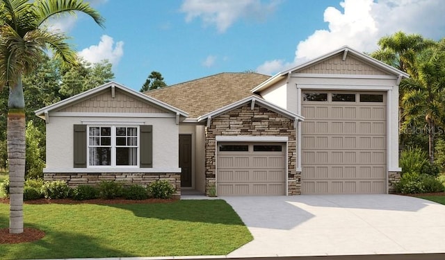 view of front of house with a front yard and a garage