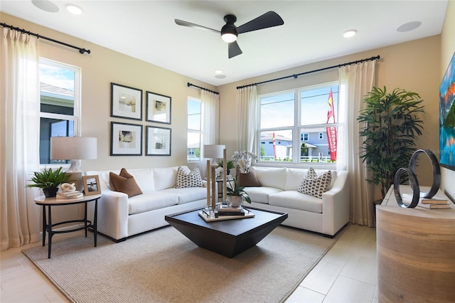 living room featuring ceiling fan and recessed lighting