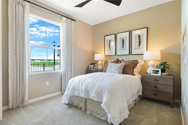 bedroom featuring ceiling fan and light carpet