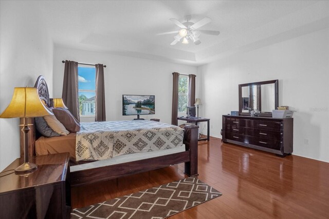 bedroom featuring hardwood / wood-style floors and ceiling fan