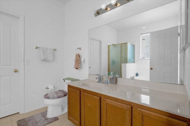 bathroom featuring walk in shower, vanity, toilet, and tile patterned floors