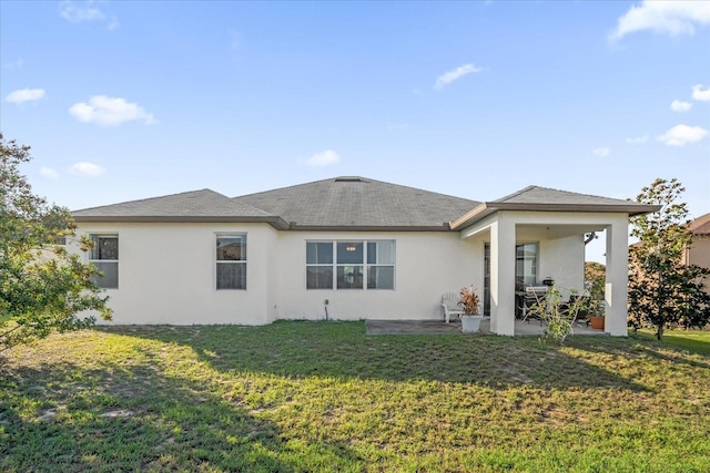 view of front of home featuring a patio area and a front lawn