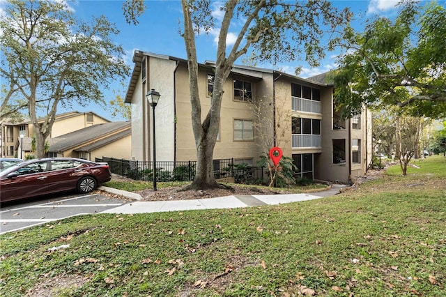 976 Leeward Pl Unit 102, Altamonte Springs, FL 32714 - view of building exterior featuring uncovered parking