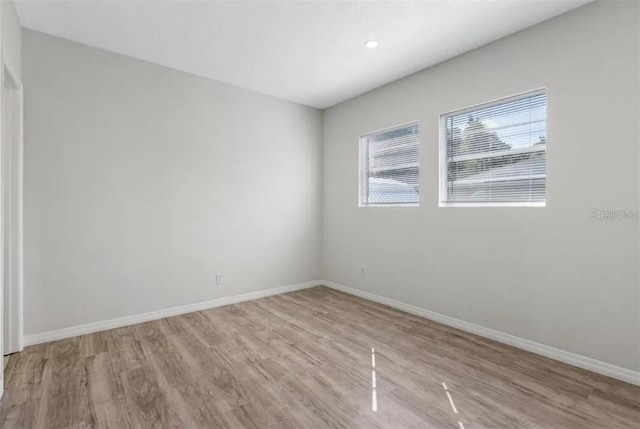 spare room with light wood-type flooring