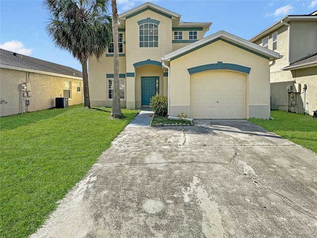 view of front of home with a garage, cooling unit, and a front yard