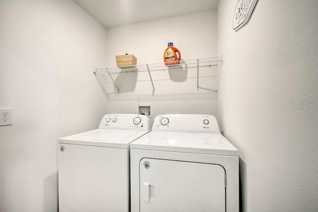 washroom featuring independent washer and dryer