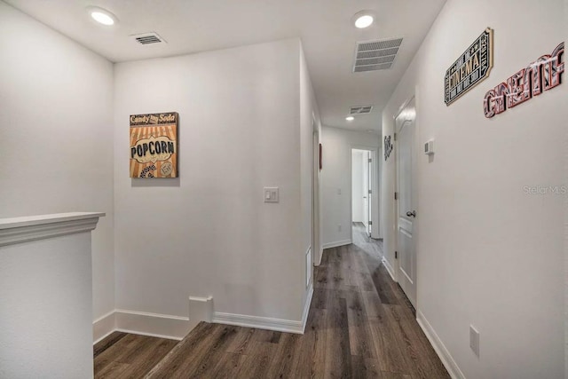 hall with dark hardwood / wood-style flooring