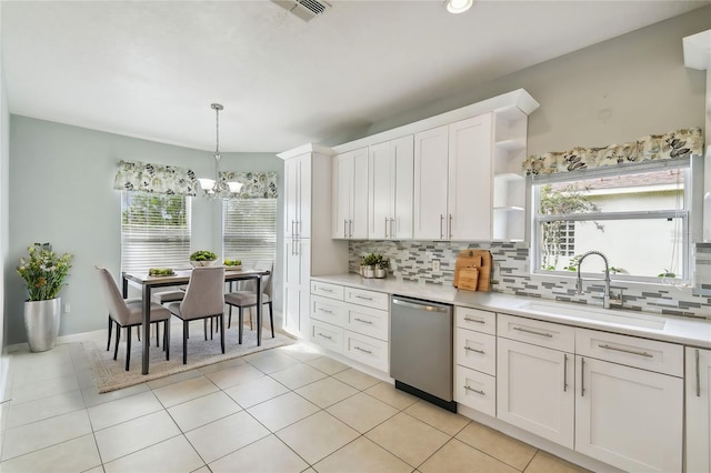 kitchen featuring white cabinetry, sink, an inviting chandelier, and dishwasher