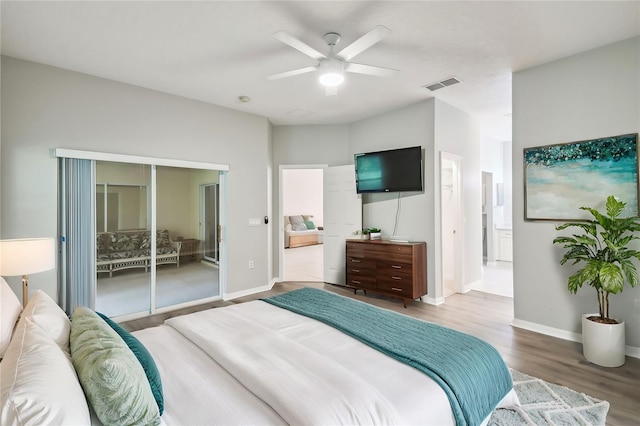 540 Genoa Dr, Poinciana, FL 34759 - bedroom featuring wood finished floors, a ceiling fan, and baseboards
