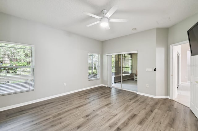 spare room featuring hardwood / wood-style flooring and ceiling fan