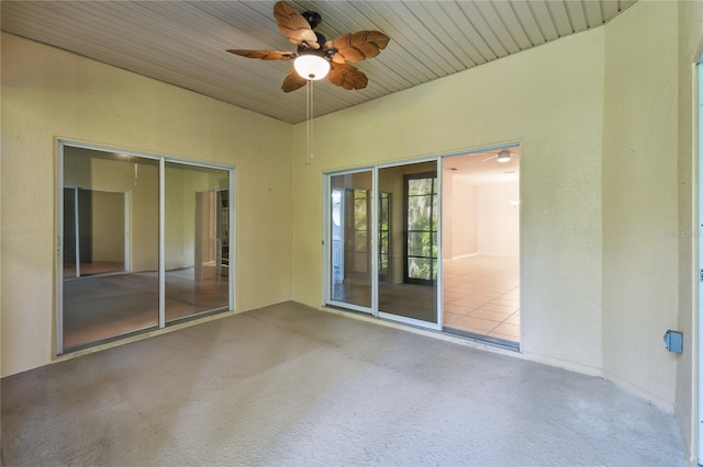 interior space featuring wood ceiling and ceiling fan