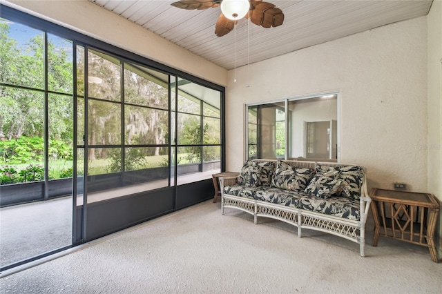 sunroom / solarium with ceiling fan and wood ceiling