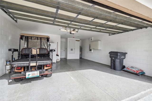 540 Genoa Dr, Poinciana, FL 34759 - garage with concrete block wall and a garage door opener