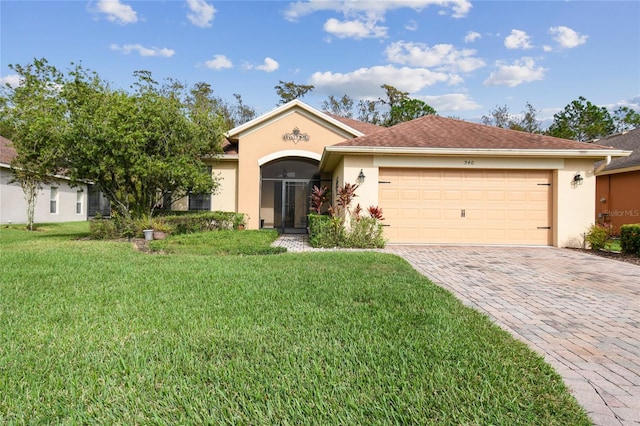 ranch-style house with a garage and a front yard