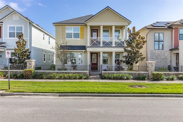 view of front of home featuring a porch and a balcony