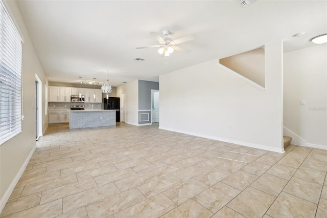 unfurnished living room featuring ceiling fan