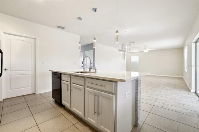 kitchen with a center island with sink, hanging light fixtures, ceiling fan, sink, and black dishwasher