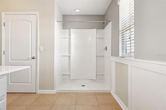 bathroom featuring tile patterned flooring and a shower