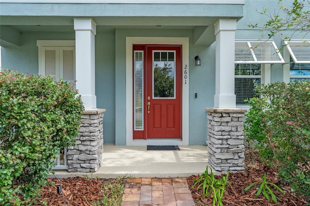 entrance to property with covered porch