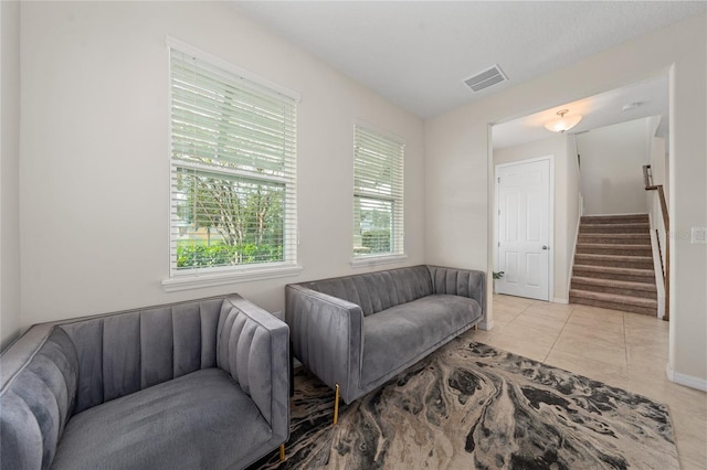 living room featuring light tile patterned flooring