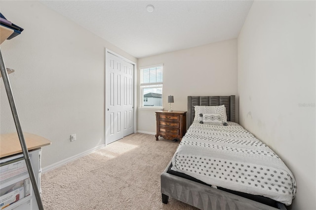 carpeted bedroom featuring a closet